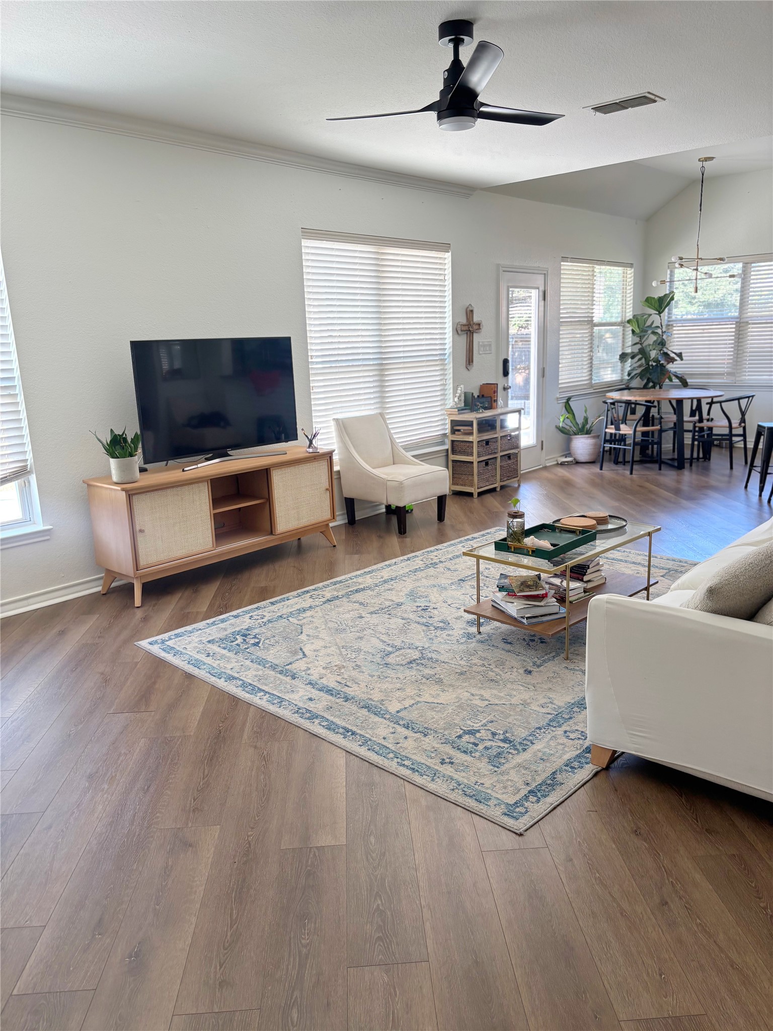 3336 Ashleys Way Marion, TX 78124 - Photo 15 of 15 Living area featuring wood finished floors, plenty of natural light, and an open floor plan