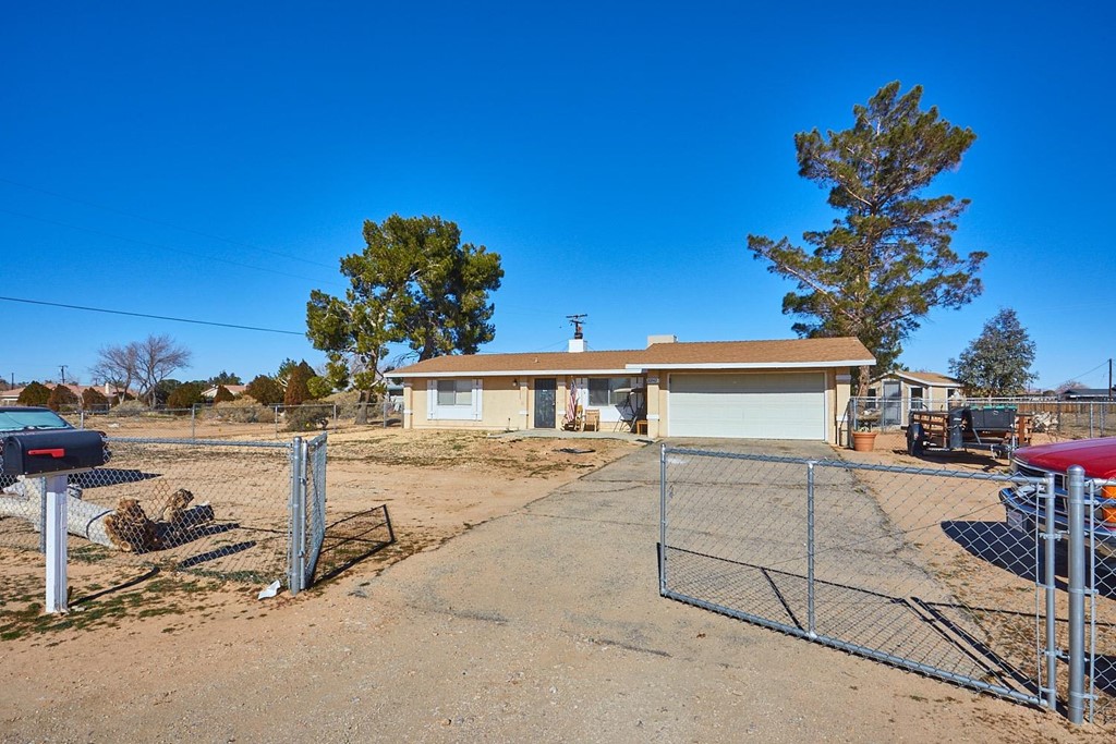 20942 Cayuga Road Apple Valley, CA 92308 - Photo 1 of 1 a view of a house with a patio