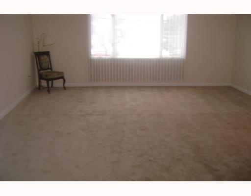 117 Ruth Place Belle Vernon, PA 15012 - Photo 7 of 8 Living Room. Spacious living room leading into formal dining room with new pergo flooring.