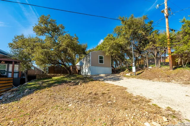 a view of a yard with a tree