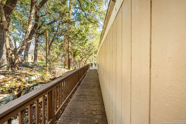 a view of balcony with wooden floor