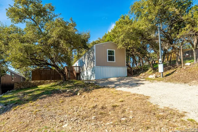 a view of a yard with a tree
