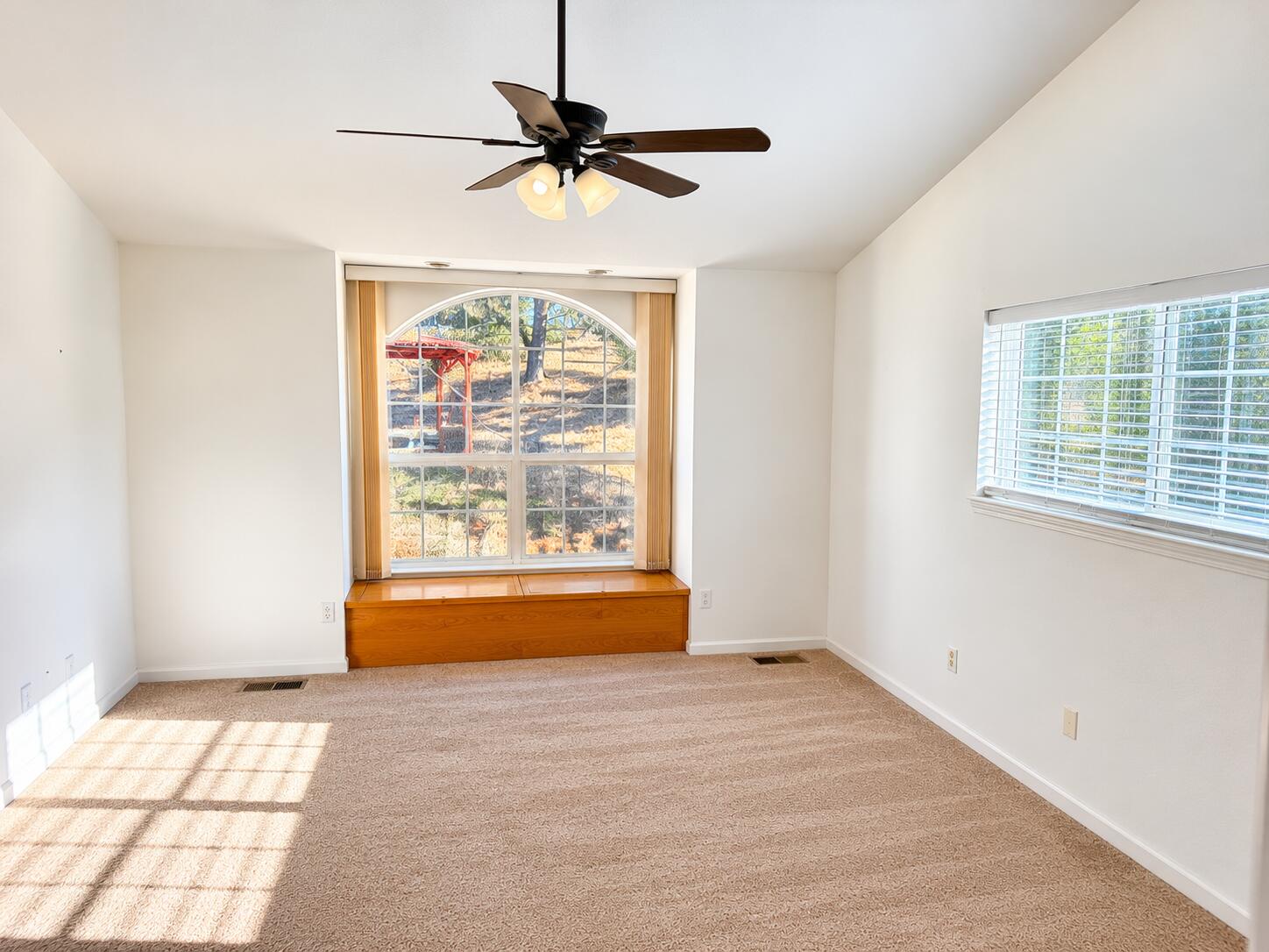 13725 Gas Point Road Igo, CA 96047 - Photo 16 of 23 Sunlit Empty Room with Arched Windowalco