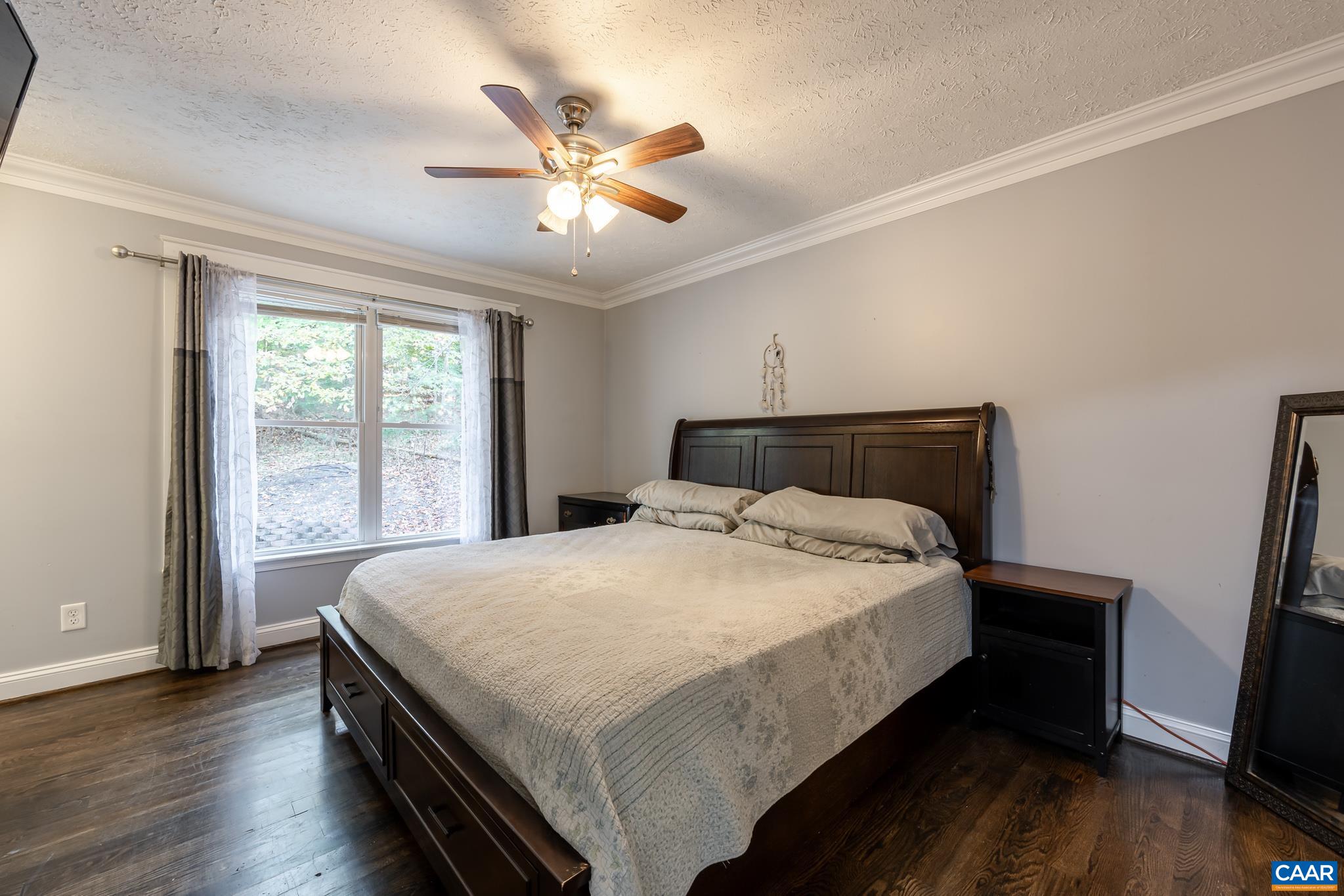 35 Brougham Road Palmyra, VA 22963 - Photo 13 of 27 a bedroom with a bed and wooden floor