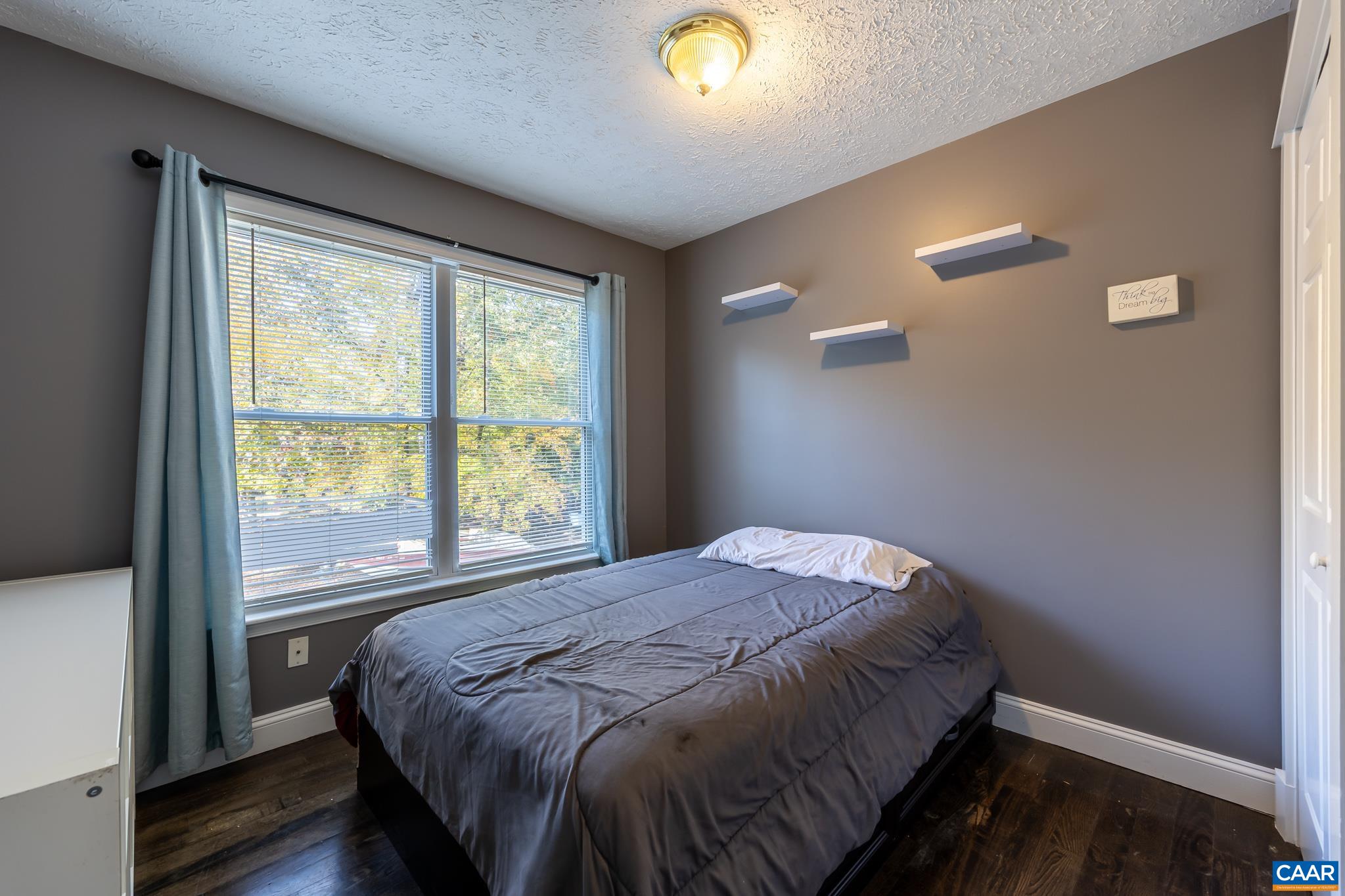 35 Brougham Road Palmyra, VA 22963 - Photo 15 of 27 a bed sitting in a bedroom next to a window