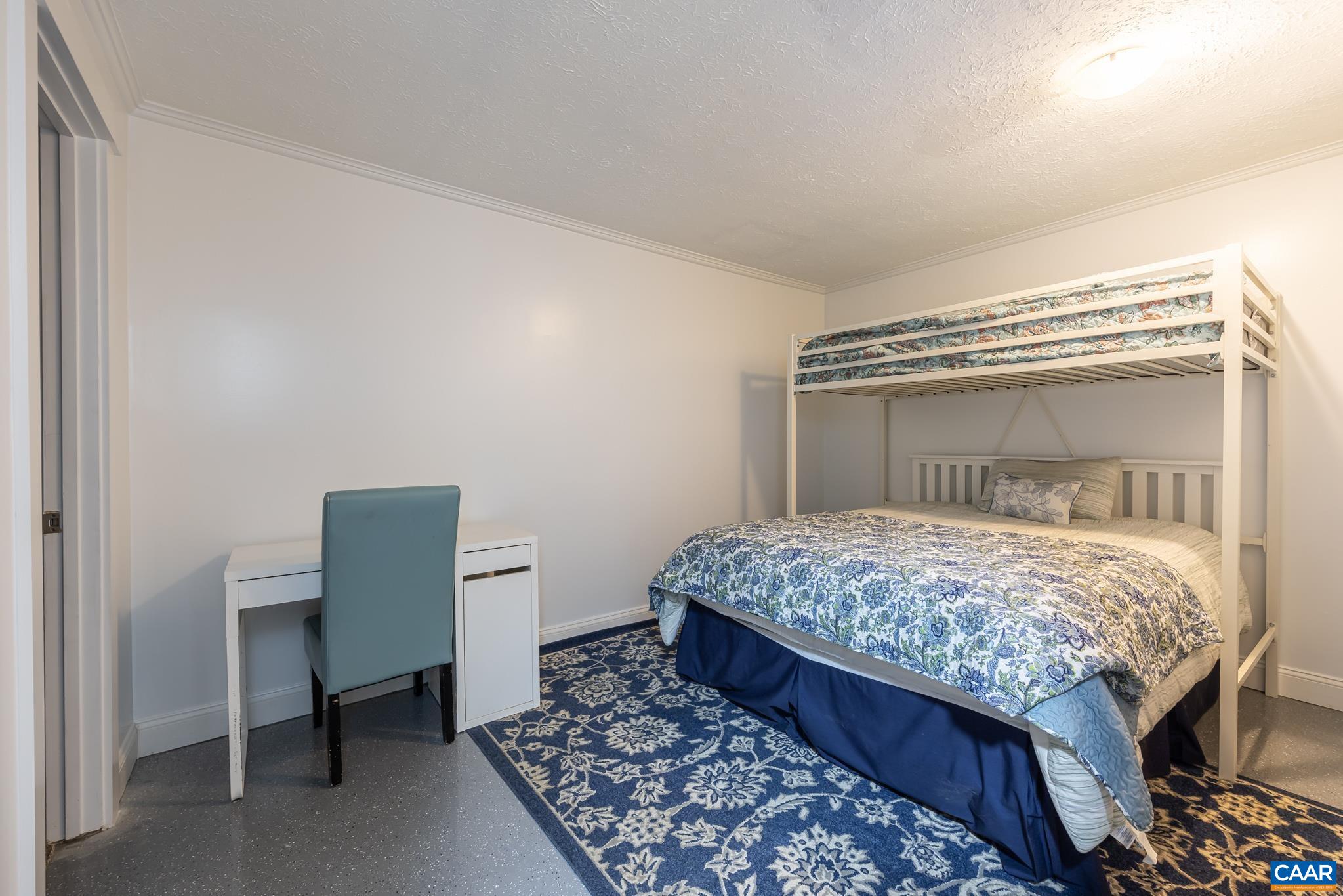 35 Brougham Road Palmyra, VA 22963 - Photo 21 of 27 a bedroom with a bed and a table in it
