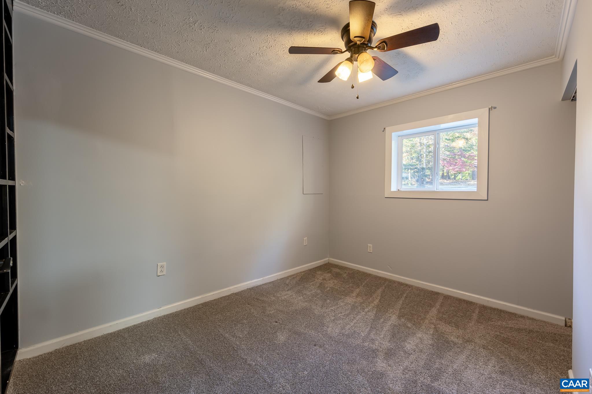 35 Brougham Road Palmyra, VA 22963 - Photo 23 of 27 an empty room with a window and a fan