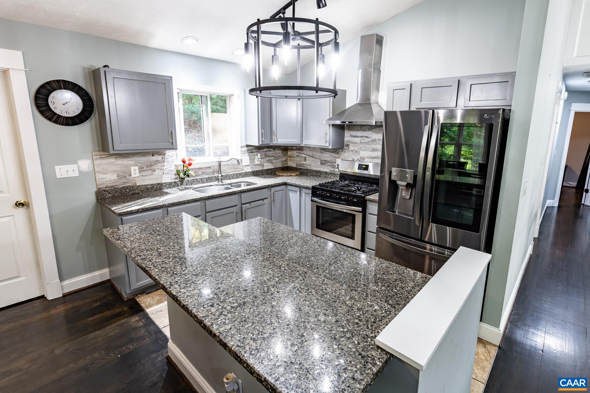 35 Brougham Road Palmyra, VA 22963 - Photo 6 of 27 a kitchen with stainless steel appliances granite countertop a sink a stove and a refrigerator