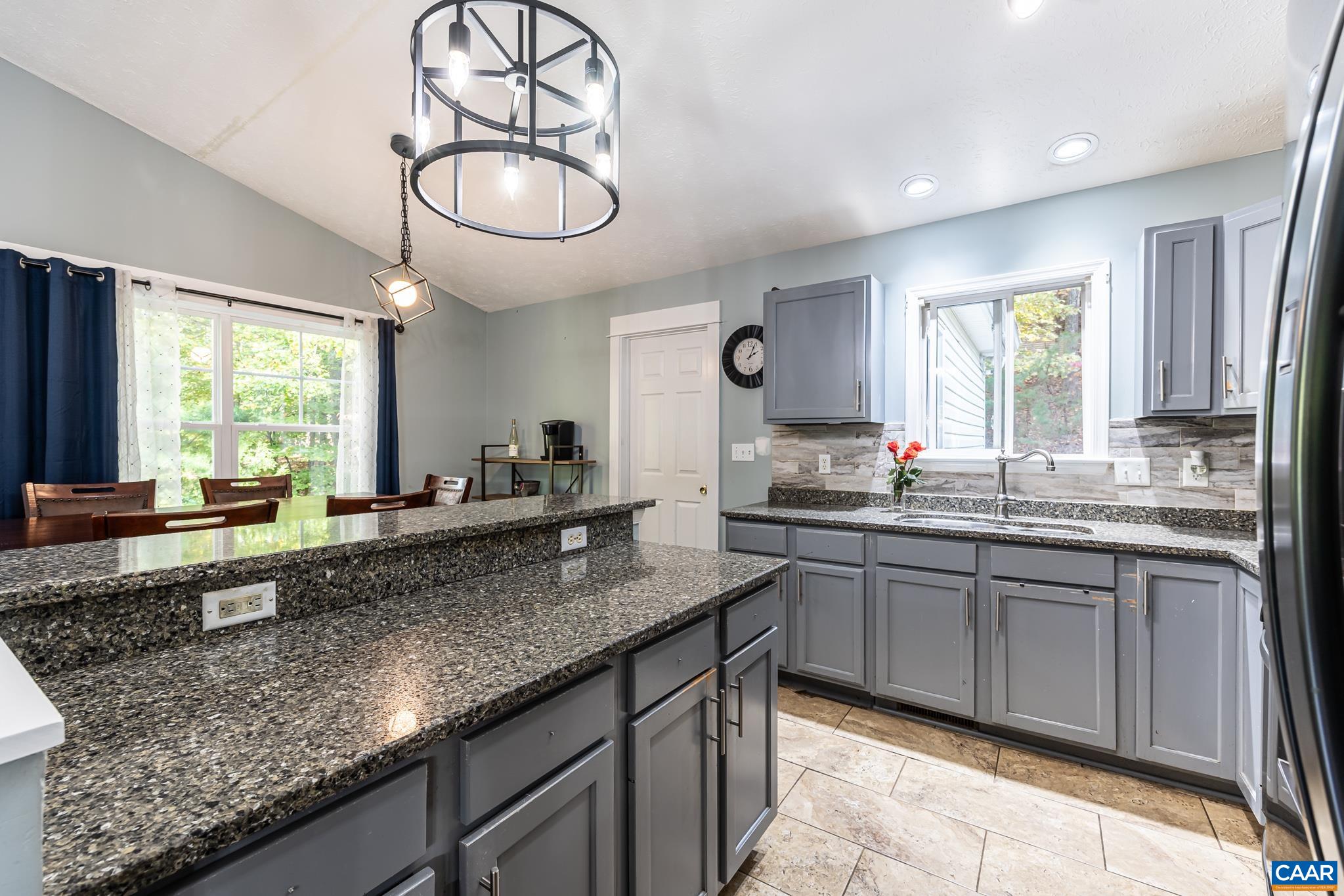 35 Brougham Road Palmyra, VA 22963 - Photo 7 of 27 a kitchen with granite countertop stainless steel appliances a sink and cabinets
