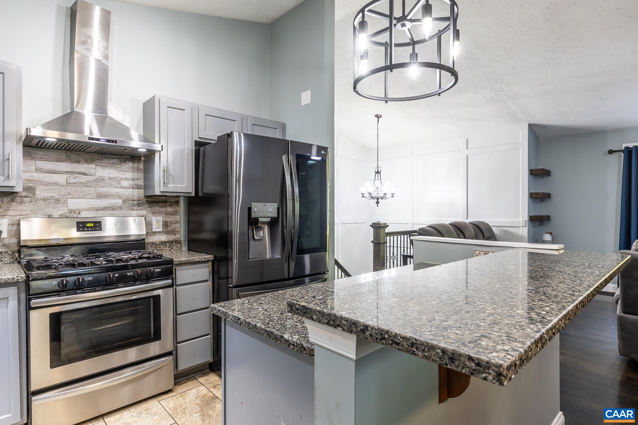 35 Brougham Road Palmyra, VA 22963 - Photo 8 of 27 a kitchen with stainless steel appliances granite countertop a sink dishwasher stove and refrigerator with wooden floor