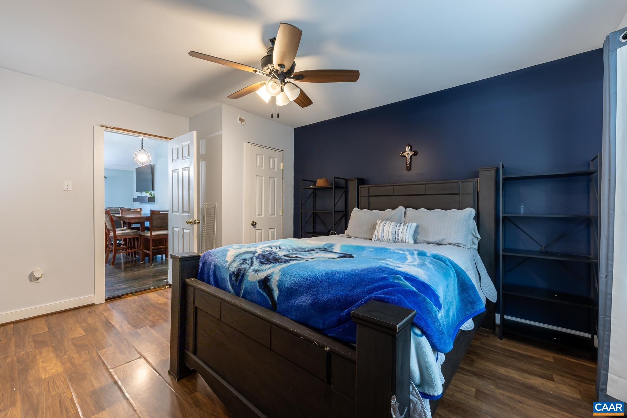 35 Brougham Road Palmyra, VA 22963 - Photo 10 of 27 a bed room with a bed and a chandelier