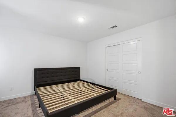 a view of room with wooden floor