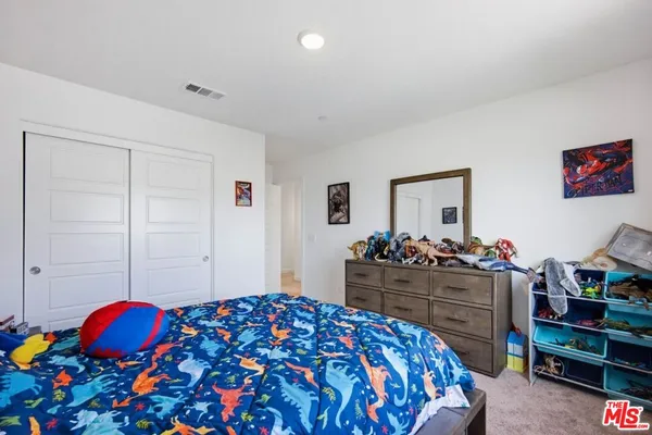 a bathroom with a double vanity sink and mirror
