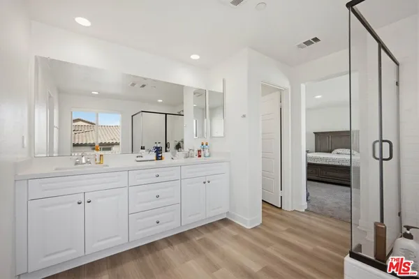 a bedroom with furniture and a window