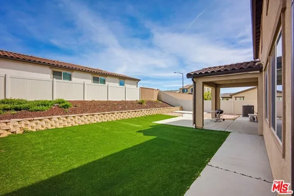 a front view of a house with a yard and porch