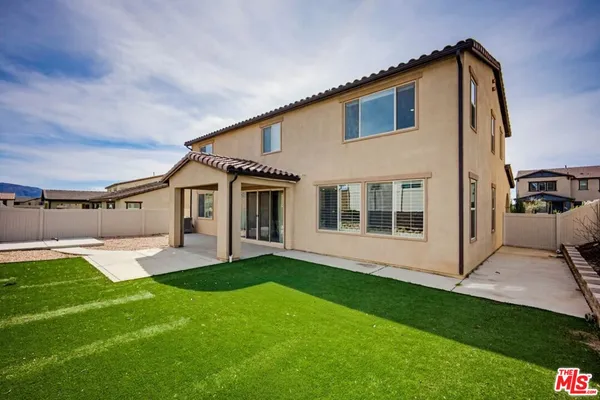 a view of a house with a street