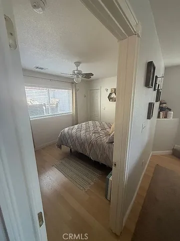 a bedroom with a bed and window
