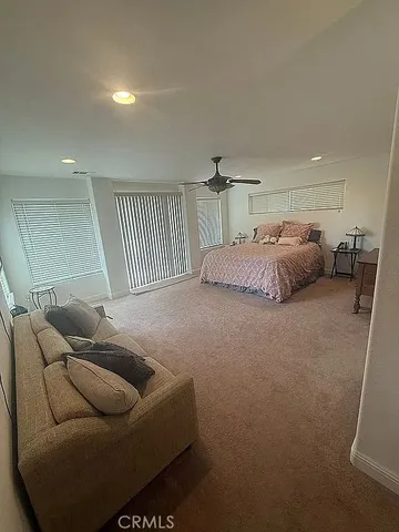 a spacious bathroom with a granite countertop sink and a mirror