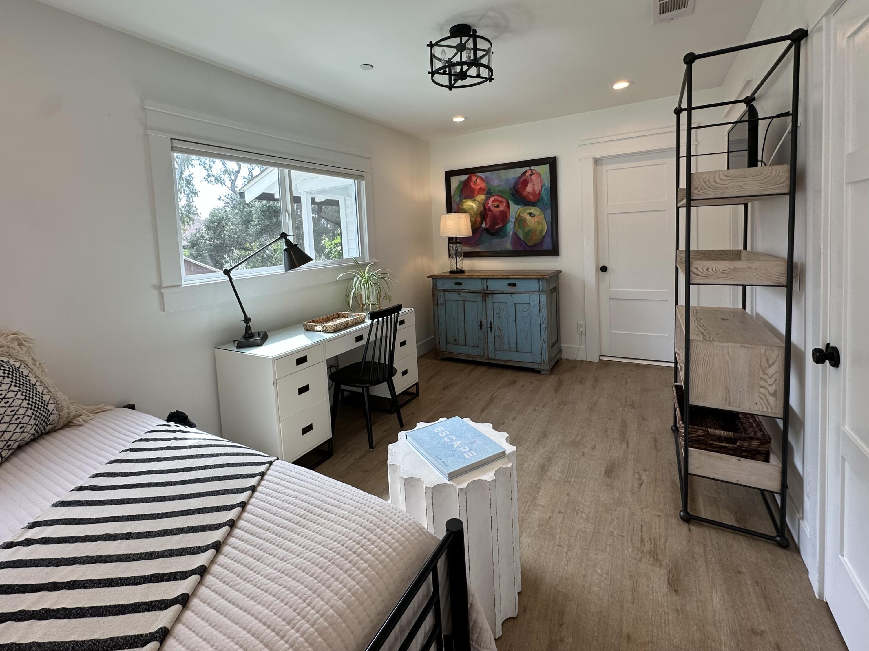 496 North La Cumbre Road Santa Barbara, CA 93110 - Photo 16 of 26 a bedroom with furniture and a flat screen tv