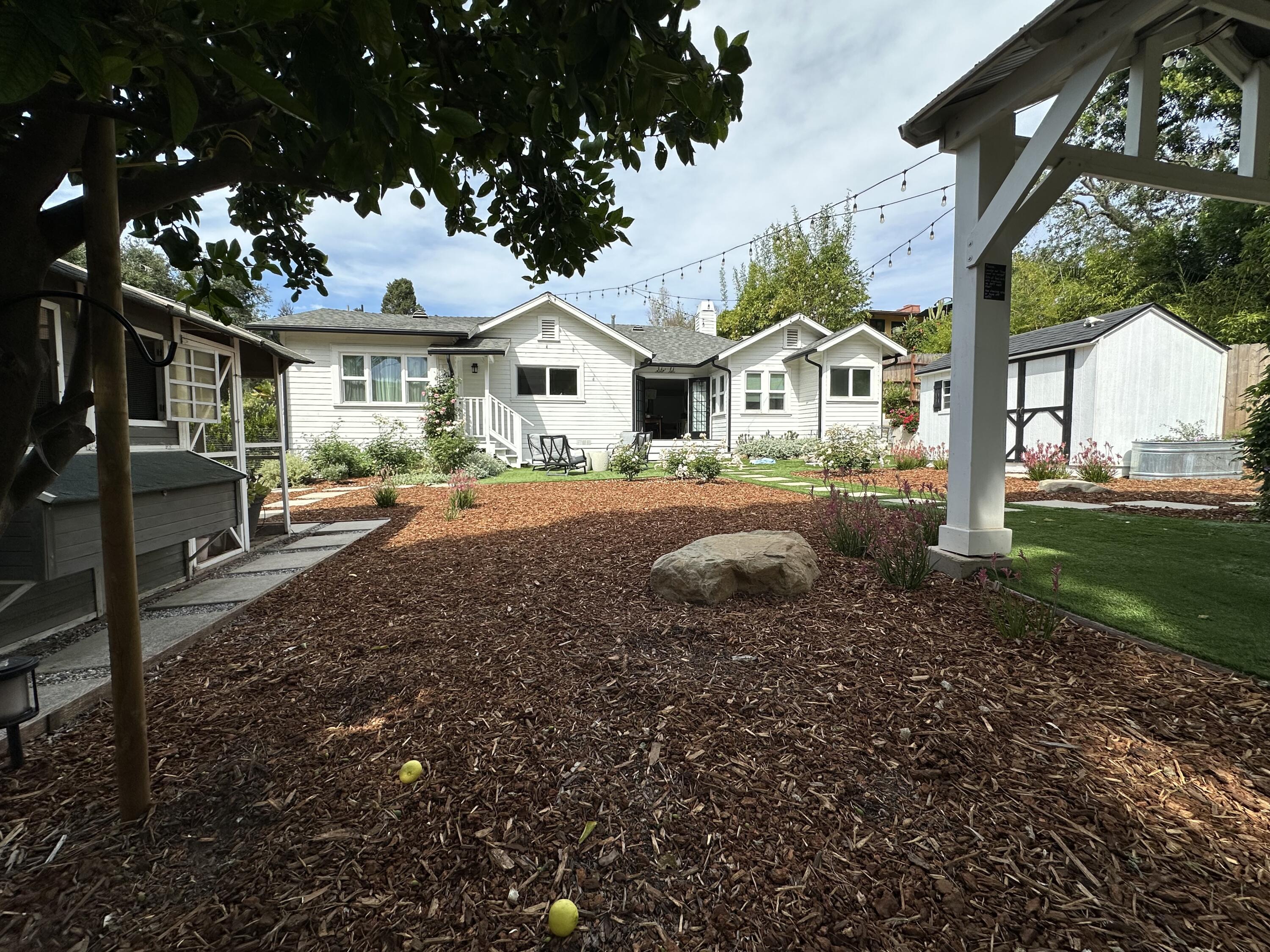 496 North La Cumbre Road Santa Barbara, CA 93110 - Photo 19 of 26 a front view of a house with a yard