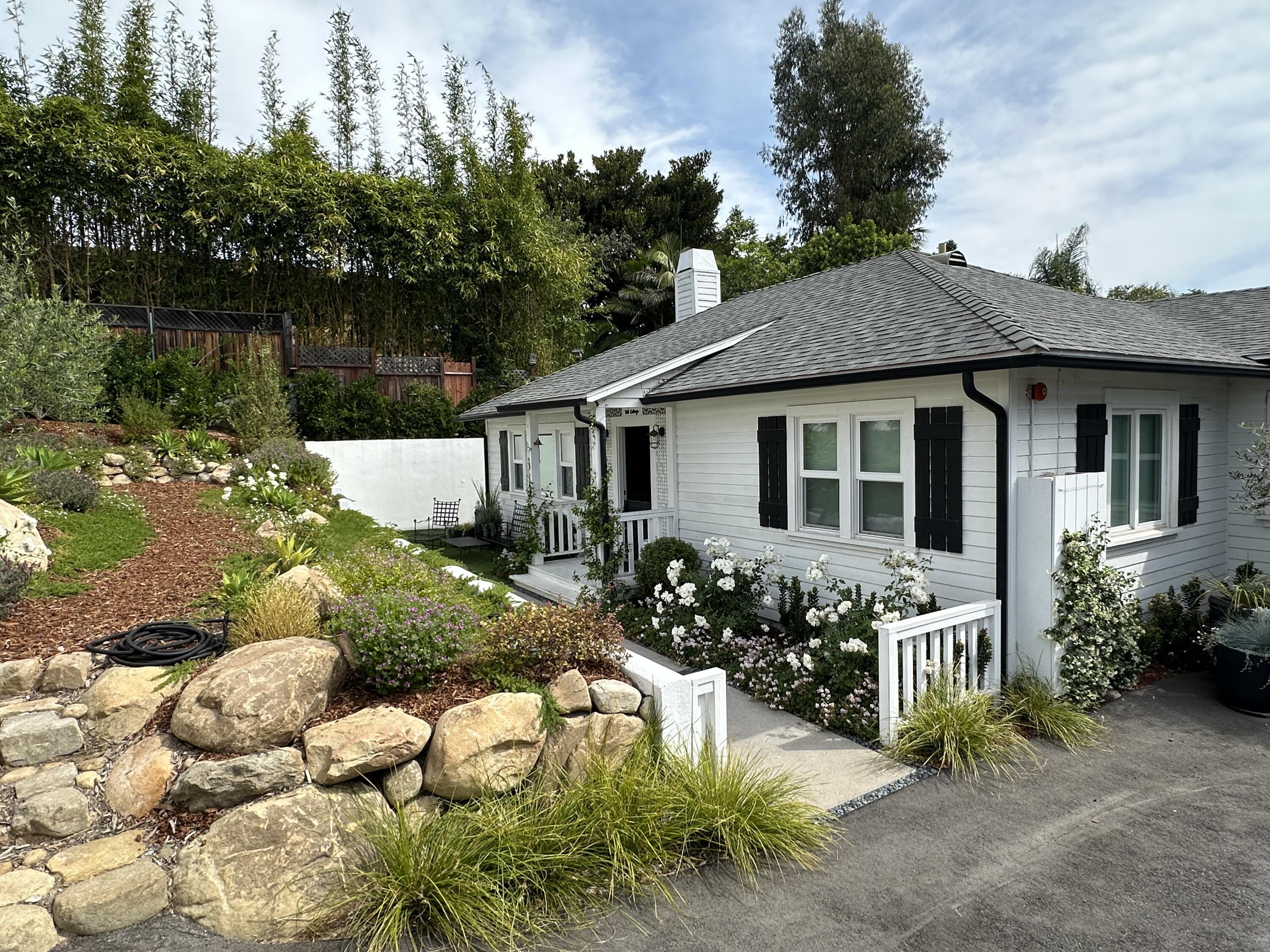 496 North La Cumbre Road Santa Barbara, CA 93110 - Photo 2 of 26 a front view of a house with a yard