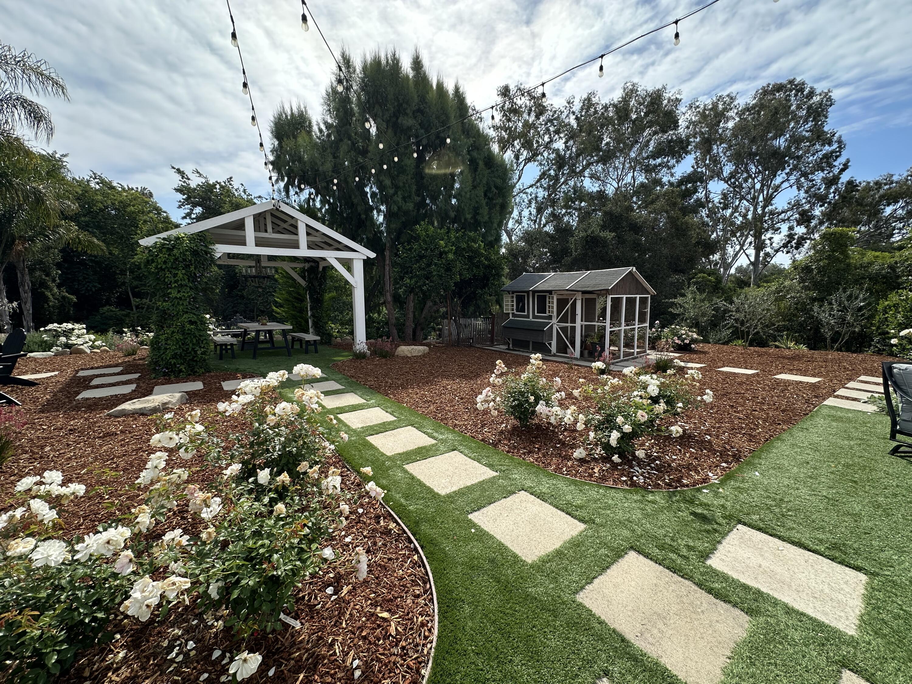 496 North La Cumbre Road Santa Barbara, CA 93110 - Photo 22 of 26 a view of a house with a yard