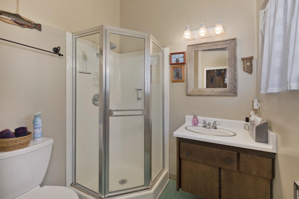 44 Tyrol Lane, Unit 209 Mammoth Lakes, CA 93546 - Photo 15 of 31 a bathroom with a sink a toilet and shower