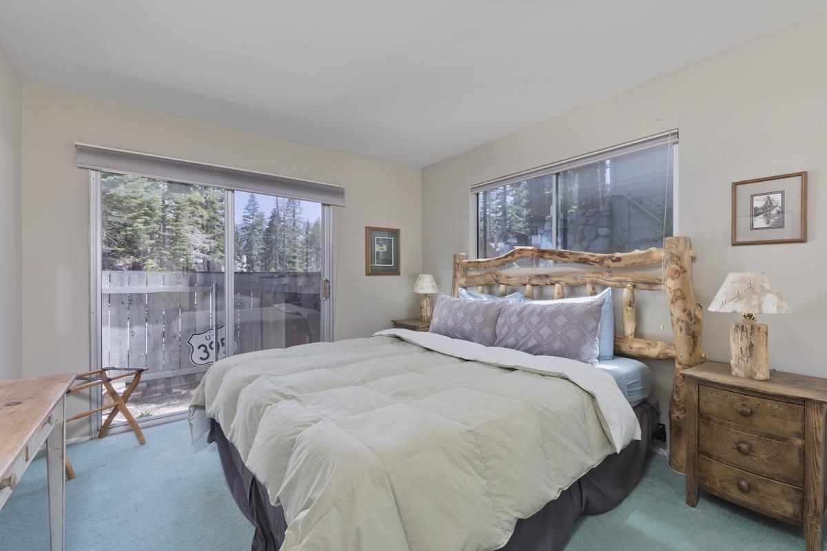 44 Tyrol Lane, Unit 209 Mammoth Lakes, CA 93546 - Photo 18 of 31 a bedroom with a bed and a large window