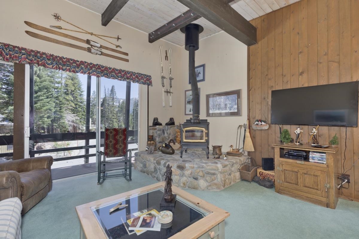 44 Tyrol Lane, Unit 209 Mammoth Lakes, CA 93546 - Photo 2 of 31 a living room with furniture and a flat screen tv