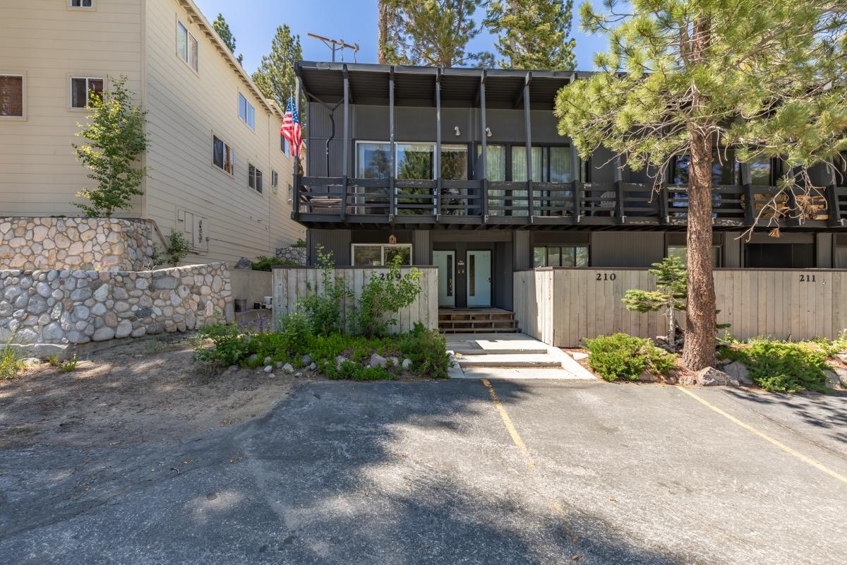 44 Tyrol Lane, Unit 209 Mammoth Lakes, CA 93546 - Photo 25 of 31 a view of a house with a yard and plants