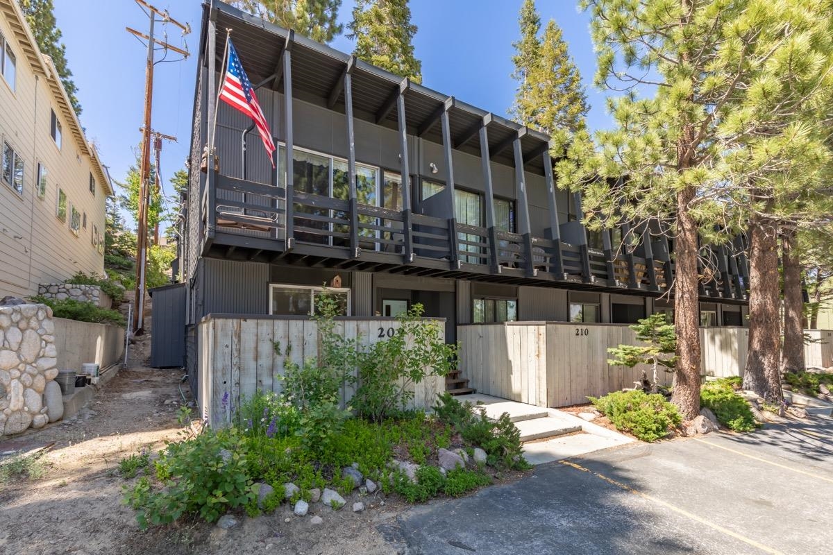 44 Tyrol Lane, Unit 209 Mammoth Lakes, CA 93546 - Photo 26 of 31 a front view of a house with a garden and plants