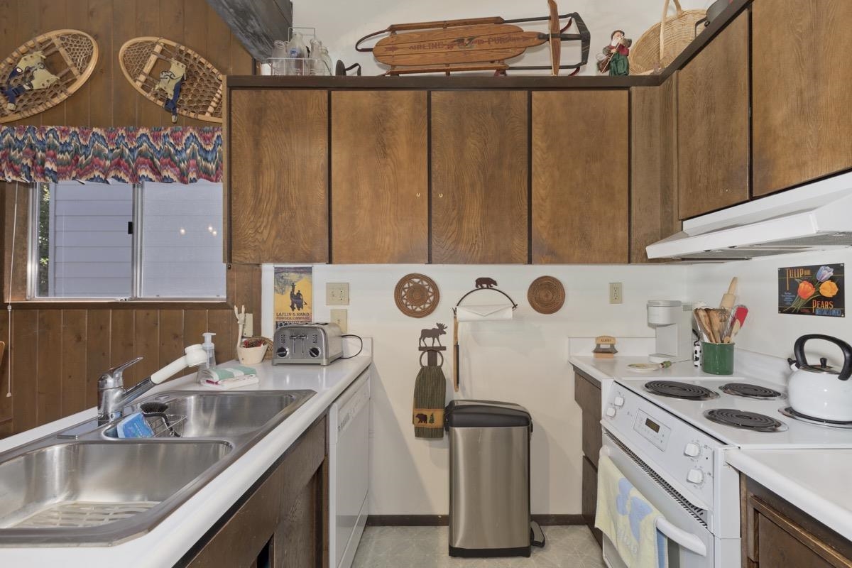 44 Tyrol Lane, Unit 209 Mammoth Lakes, CA 93546 - Photo 9 of 31 a kitchen with a sink a stove and cabinets