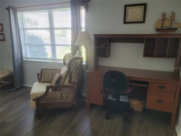 a living room with furniture and a window