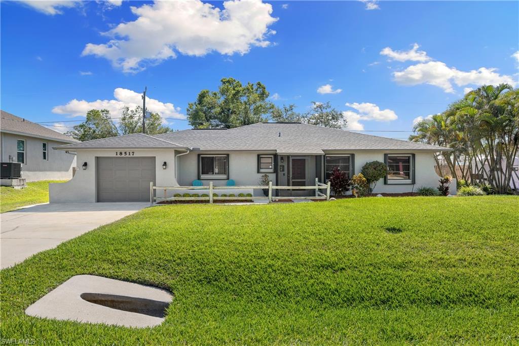 a view of a house with a swimming pool and a yard