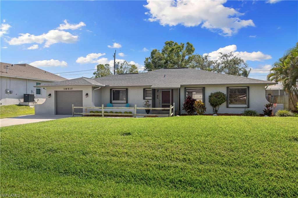 18517 Sebring Road Fort Myers, FL 33967 - Photo 2 of 32 a front view of a house with yard patio and swimming pool