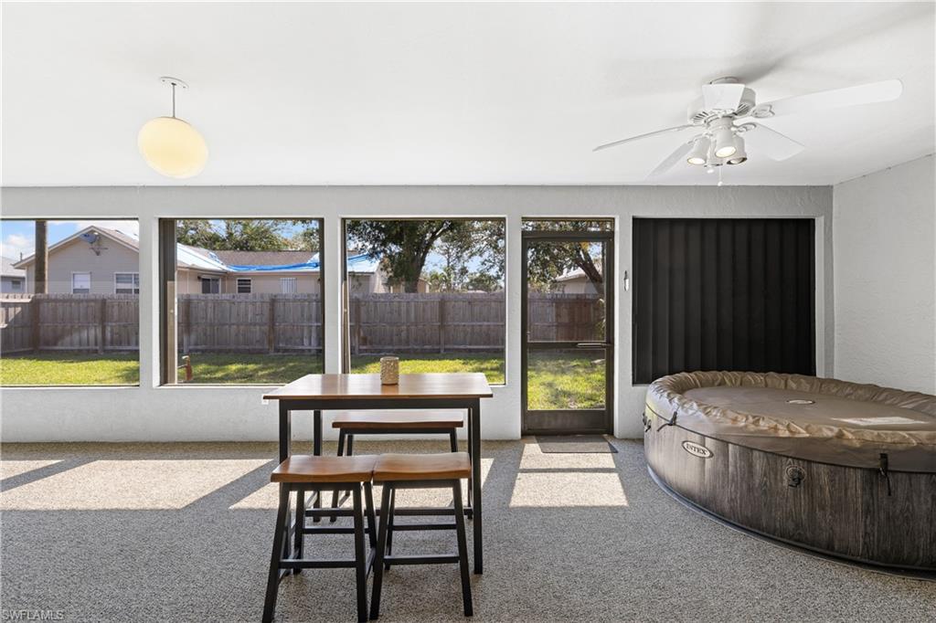 18517 Sebring Road Fort Myers, FL 33967 - Photo 21 of 32 a living room with furniture and a large window