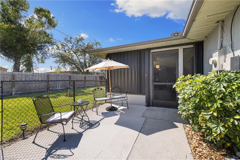 18517 Sebring Road Fort Myers, FL 33967 - Photo 23 of 32 a view of a chairs and table in the patio