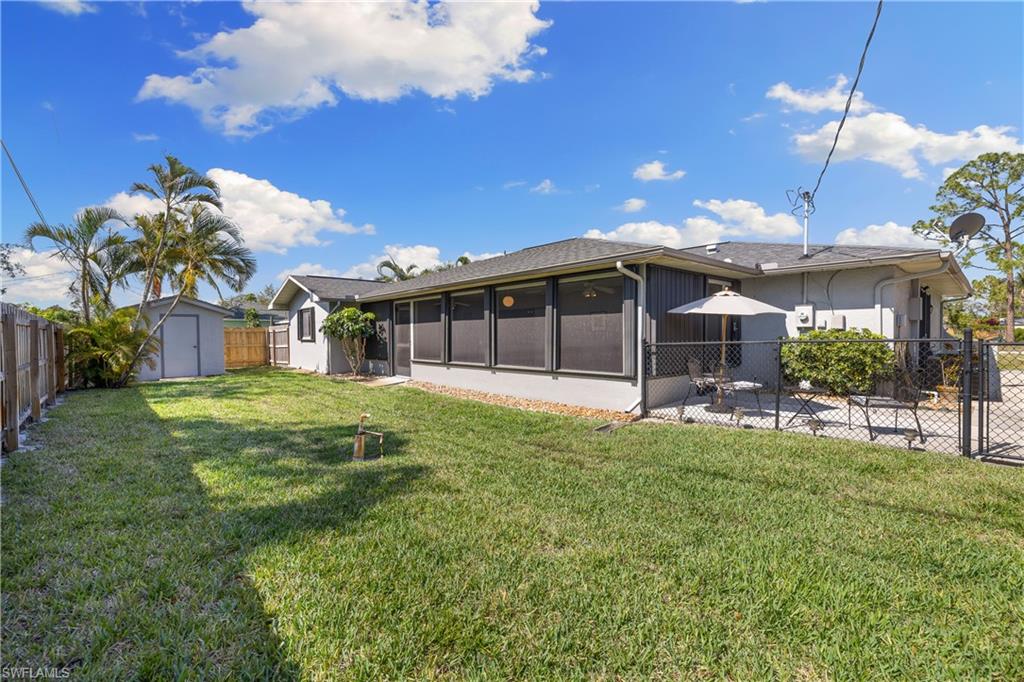 18517 Sebring Road Fort Myers, FL 33967 - Photo 24 of 32 a view of a house with a backyard