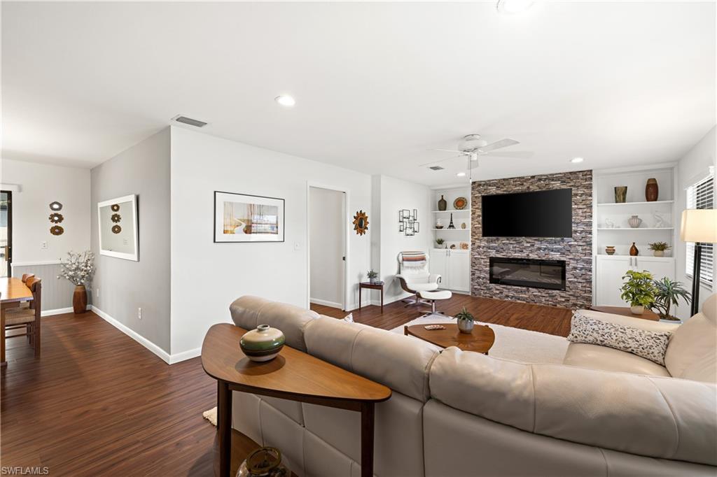18517 Sebring Road Fort Myers, FL 33967 - Photo 7 of 32 a living room with furniture and a flat screen tv