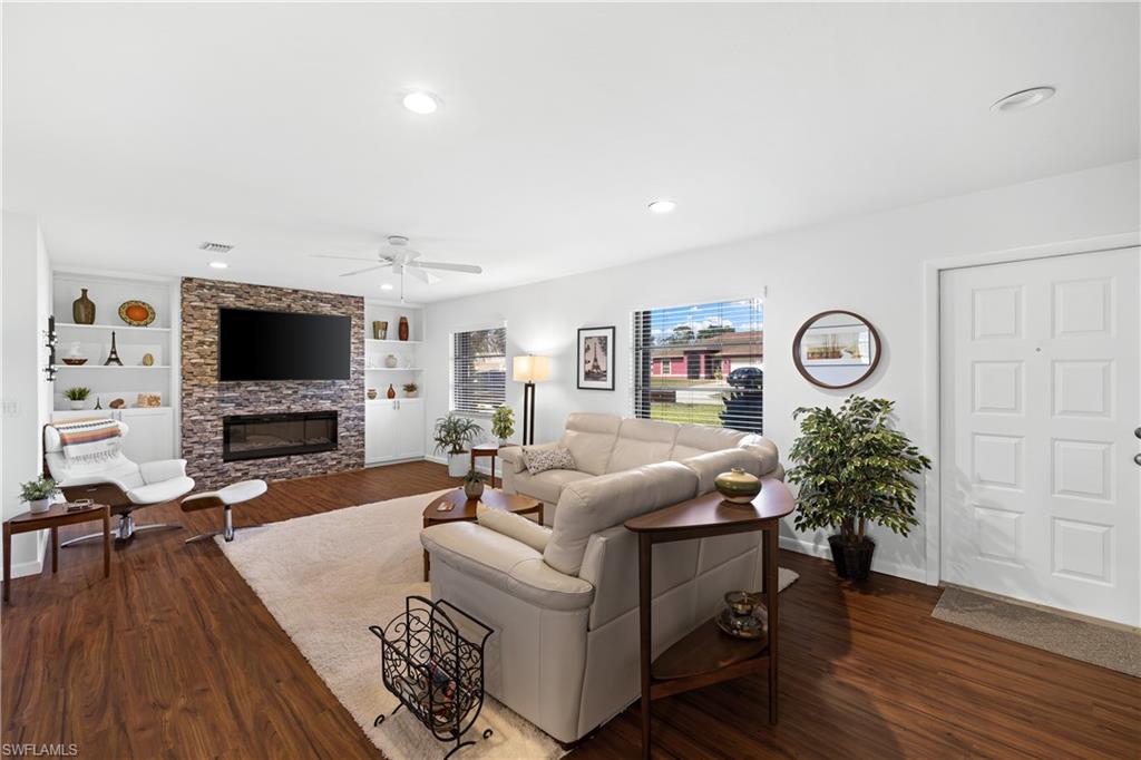 18517 Sebring Road Fort Myers, FL 33967 - Photo 8 of 32 a living room with furniture and a flat screen tv