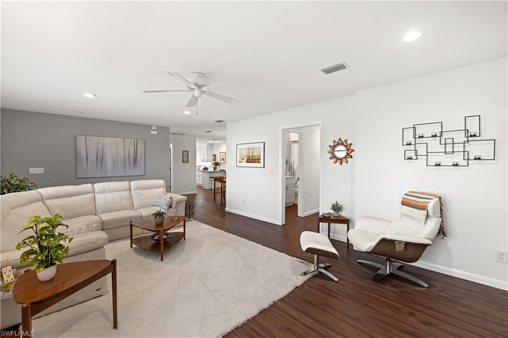 18517 Sebring Road Fort Myers, FL 33967 - Photo 9 of 32 a living room with furniture and wooden floor