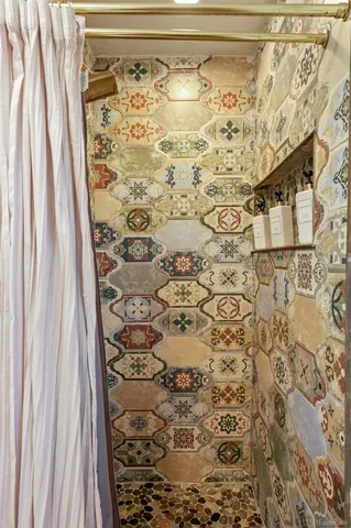 a bathroom with a shower curtain