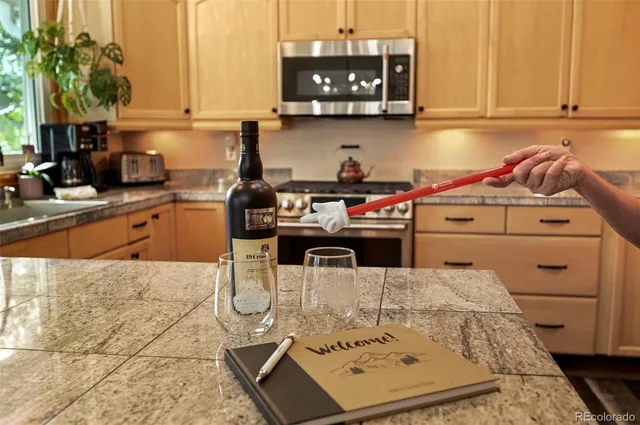 a kitchen with stainless steel appliances kitchen island granite countertop a sink and cabinets