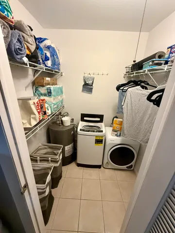 a view of a storage & utility room with washer and dryer