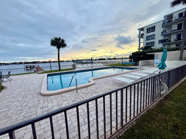 a view of a terrace with wooden floor and fence