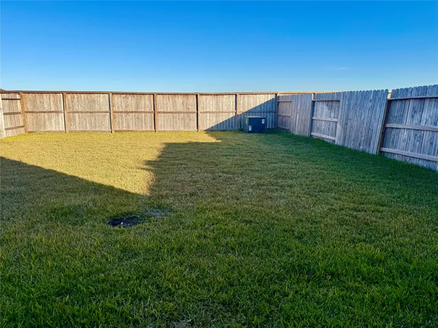a view of a backyard of the house