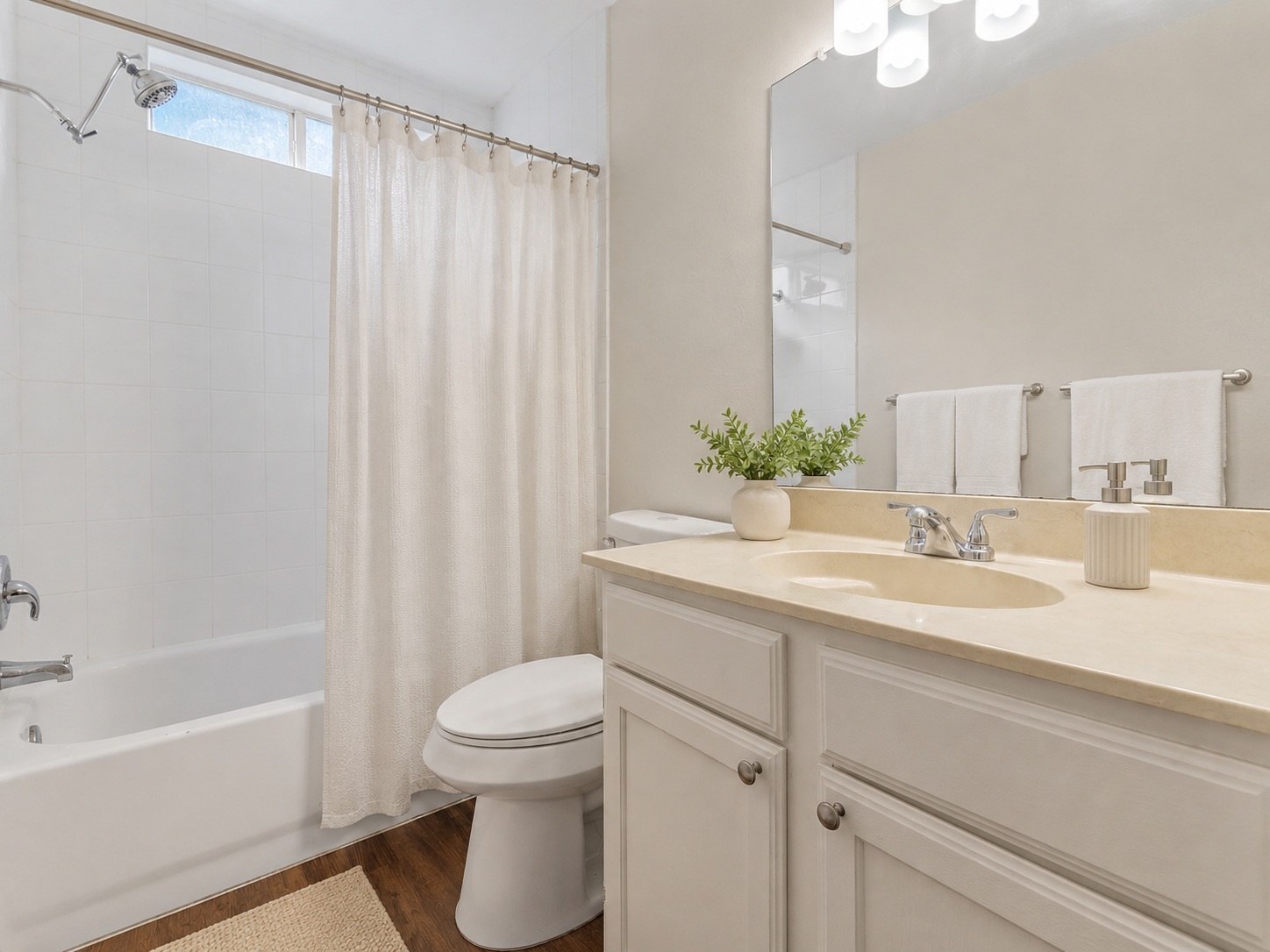 1707 Waterloo Trail, Unit A Austin, TX 78704 - Photo 8 of 8 A well-appointed bath features a deep soaking tub and an ample vanity with generous counter space.