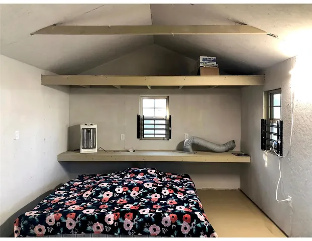 a view of a workspace with furniture