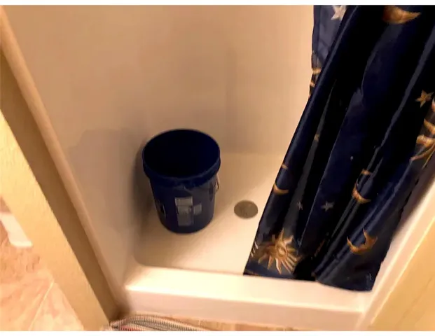 a bathroom with a sink a mirror and shower