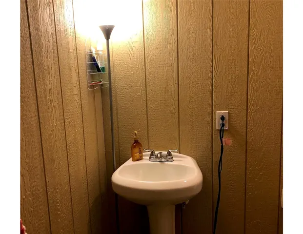 a bathroom with a sink and toilet
